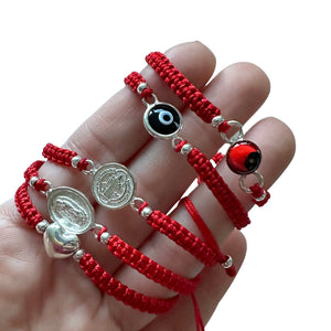 Braided red bracelet with charm